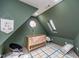 Cozy bedroom featuring slanted ceilings, natural light, and stylish decor at 1617 Jenkins Rd, Wake Forest, NC 27587