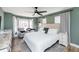 Cozy bedroom with bay window, ceiling fan and wood-look flooring at 1617 Jenkins Rd, Wake Forest, NC 27587