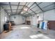 A garage interior showcasing metal walls, concrete floors, and ample storage space at 1617 Jenkins Rd, Wake Forest, NC 27587