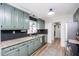 Updated kitchen with sleek countertops, herringbone backsplash and modern appliances at 1617 Jenkins Rd, Wake Forest, NC 27587