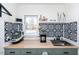 Close up of the modern laundry area with counter space and decor at 1617 Jenkins Rd, Wake Forest, NC 27587