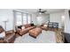 Bright living room with hardwood floors, neutral walls, and comfortable leather seating at 1617 Jenkins Rd, Wake Forest, NC 27587