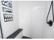 Elegant shower with vertical white tiles, black accents, and recessed shelving for toiletries at 1617 Jenkins Rd, Wake Forest, NC 27587
