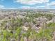 Aerial view of neighborhood with single-Gathering homes, mature trees, and clear blue skies at 1911 Stadium Dr, Durham, NC 27705