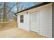 Back porch shows access to the yard with a new outdoor light at 1911 Stadium Dr, Durham, NC 27705