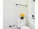 Bathroom featuring a toilet with a flower vase, towel rack, and a shower head at 1911 Stadium Dr, Durham, NC 27705
