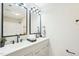 Modern bathroom with double sinks, updated fixtures, granite countertops, and a shower-tub combo at 1911 Stadium Dr, Durham, NC 27705