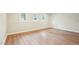 Bonus room featuring wood flooring, neutral paint, and bright windows at 1911 Stadium Dr, Durham, NC 27705