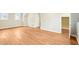 Bonus room featuring wood flooring, neutral paint, bright windows, and a doorway at 1911 Stadium Dr, Durham, NC 27705