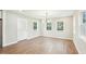 Spacious dining area featuring hardwood floors, natural light, and an open layout, perfect for Gathering gatherings at 1911 Stadium Dr, Durham, NC 27705