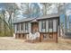 Charming two-story home with gray siding, brick foundation, and a well-manicured lawn at 1911 Stadium Dr, Durham, NC 27705
