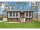 Charming two-story home featuring a brick and siding exterior with a well-manicured lawn and inviting entrance at 1911 Stadium Dr, Durham, NC 27705