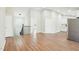 An open-concept living area featuring hardwood floors and stairs at 1911 Stadium Dr, Durham, NC 27705