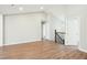 An open-concept living area featuring hardwood floors, high ceiling and stairs at 1911 Stadium Dr, Durham, NC 27705