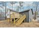 View of the back of the home with deck and stairs at 1911 Stadium Dr, Durham, NC 27705