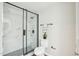 Bathroom features a sleek glass shower with marble tile surround at 1911 Stadium Dr, Durham, NC 27705