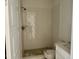 Bathroom featuring white tiled shower with a bronze shower head and tile flooring at 1912 Harrell Cove Ct # 171 Gunnison Cr, Fuquay Varina, NC 27526