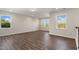 Bonus room with neutral paint, wood-look floors, recessed lighting, and bright windows at 1912 Harrell Cove Ct # 171 Gunnison Cr, Fuquay Varina, NC 27526