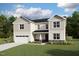 Newly built two-story home with white siding, stone accents, and a well-manicured lawn at 1912 Harrell Cove Ct # 171 Gunnison Cr, Fuquay Varina, NC 27526