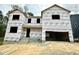 New two-story home construction with visible framing and weather-resistant wrap at 1912 Harrell Cove Ct # 171 Gunnison Cr, Fuquay Varina, NC 27526