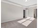 Spacious main bedroom with neutral carpet, paint and tray ceiling with lighting at 1912 Harrell Cove Ct # 171 Gunnison Cr, Fuquay Varina, NC 27526