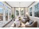 Bright sun room features lots of natural light and decor at 1912 Harrell Cove Ct # 171 Gunnison Cr, Fuquay Varina, NC 27526