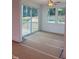 Sunroom offers access to a deck and a beautiful backyard view with abundant natural light from multiple windows at 1912 Harrell Cove Ct # 171 Gunnison Cr, Fuquay Varina, NC 27526