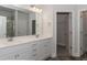 Bathroom featuring a double sink vanity, a large mirror and views of the walk-in shower and water closet at 20 Watermelon Dr, Franklinton, NC 27525