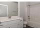 Bright bathroom features a white vanity, large mirror, tub, and shower at 20 Watermelon Dr, Franklinton, NC 27525