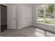 Comfortable bedroom with a large window, closet, and plush carpet at 20 Watermelon Dr, Franklinton, NC 27525