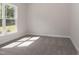 Bedroom featuring a large window allowing natural light, plush carpet and a neutral paint palette at 20 Watermelon Dr, Franklinton, NC 27525
