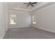 Spacious bedroom featuring trey ceiling, ceiling fan, neutral color palette, and natural light at 20 Watermelon Dr, Franklinton, NC 27525