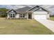 Charming home with a landscaped front yard and a two-car garage at 20 Watermelon Dr, Franklinton, NC 27525