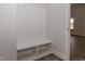 Inviting mudroom features a built-in bench with storage cubbies and coat hooks for organization at 20 Watermelon Dr, Franklinton, NC 27525