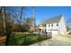 Back exterior featuring an iron fence, 2 car garage and screened-in porch at 206 Pine St, Fuquay Varina, NC 27526