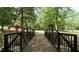 Scenic view of a charming bridge in a tranquil park setting surrounded by lush trees at 206 Pine St, Fuquay Varina, NC 27526