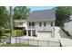 Shot of the back of the home showing the two-car garage, screened-in deck and paving stone entrance at 206 Pine St, Fuquay Varina, NC 27526