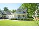 Beautiful home with a cozy front porch and lush green lawn at 206 Pine St, Fuquay Varina, NC 27526