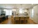 Eat-in kitchen has a large center island with seating, stainless appliances, and an open floor plan at 206 Pine St, Fuquay Varina, NC 27526