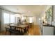 Open concept kitchen featuring stainless steel appliances, a large island, and a view into the adjacent living area at 206 Pine St, Fuquay Varina, NC 27526