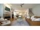Inviting living room with fireplace, wood floors, open to dining and kitchen at 206 Pine St, Fuquay Varina, NC 27526