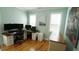 Office with hardwood flooring, a large desk, and natural light at 206 Pine St, Fuquay Varina, NC 27526