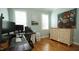 Office with hardwood flooring, a large desk, and natural light at 206 Pine St, Fuquay Varina, NC 27526