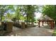This listing photo shows a stone bridge and gazebo in a park-like setting at 206 Pine St, Fuquay Varina, NC 27526