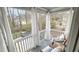 Inviting porch with sheer curtains providing privacy and views of the surrounding greenery at 206 Pine St, Fuquay Varina, NC 27526