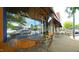 A sidewalk cafe seating area sits outside of Stick Boy Bread, a local bakery at 206 Pine St, Fuquay Varina, NC 27526