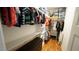 Spacious walk-in closet with custom shelving, drawers, and ample storage space at 206 Pine St, Fuquay Varina, NC 27526