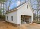 Detached garage with white siding and an open bay, ready for vehicles and storage needs at 207 Holleman St, Apex, NC 27502