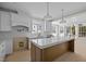 Bright kitchen with a spacious center island, pendant lighting, and natural light at 207 Holleman St, Apex, NC 27502