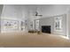 Spacious living room featuring a fireplace, large windows, and bright lighting at 207 Holleman St, Apex, NC 27502